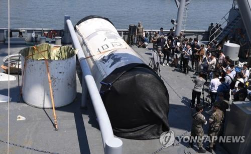 The salvaged wreckage of a North Korean space rocket is displayed on the deck of the ROKS Gwangyang at the Navy's Second Fleet in Pyeongtaek, 60 kilometers south of Seoul, on June 16, 2023. (Pool photo) (Yonhap)