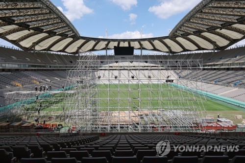 Workers install a makeshift stage for the "K-pop super live" concert, the highlight event for the 2023 World Scout Jamboree, at Seoul World Cup Stadium in western Seoul on Aug. 9, 2023. The concert and the closing ceremony of the world gathering will be held at the stadium on Aug. 11. (Yonhap)