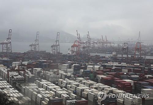 Shipping containers are stacked at a pier in South Korea's largest port city of Busan, 320 kilometers south of Seoul, on Sept. 1, 2023. (Yonhap)