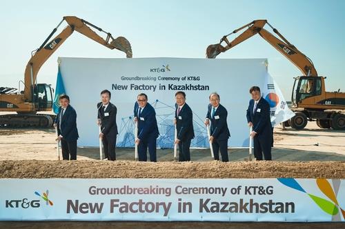 In this file photo taken Oct. 11, 2023, and provided by KT&G, the company's CEO Baek Bok-in (3rd from R), Almaty Gov. Marat Sultangaziyev (3rd from L), Korean Consul General in Almaty Park Nae-cheon (2nd from L) and other officials attend the groundbreaking ceremony in Kazakhstan for KT&G's fourth overseas plant. (PHOTO NOT FOR SALE) (Yonhap)