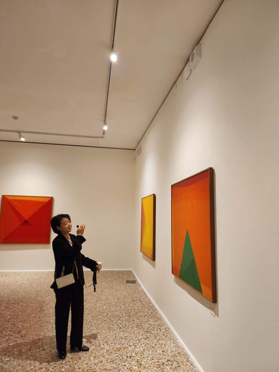 The exhibition's curator, Kim In-hye, explains Yoo Young-kuk's art world at the Fondazione Querini Stampalia in Venice on April 17, 2024. (Yonhap)