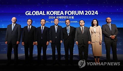 Participants in the Global Korea Forum, a global forum hosted by the unification ministry and designed to garner international support for South Korea's bid for peaceful unification, pose for a photo before the forum on Sept. 3, 2024. (Yonhap)