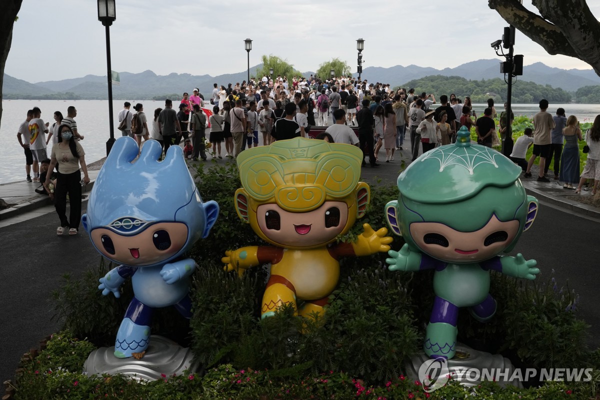 This Associated Press file photo from June 26, 2023, shows the mascots of the Hangzhou Asian Games on display in Hangzhou, China. (Yonhap)