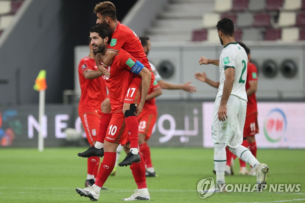 In this AFP photo, Iran players celebrate their 3-0 win over Iraq in the teams' Group A match in the final Asian qualifying round for the 2022 FIFA World Cup at Khalifa International Stadium in Doha on Sept. 7, 2021. (Yonhap)