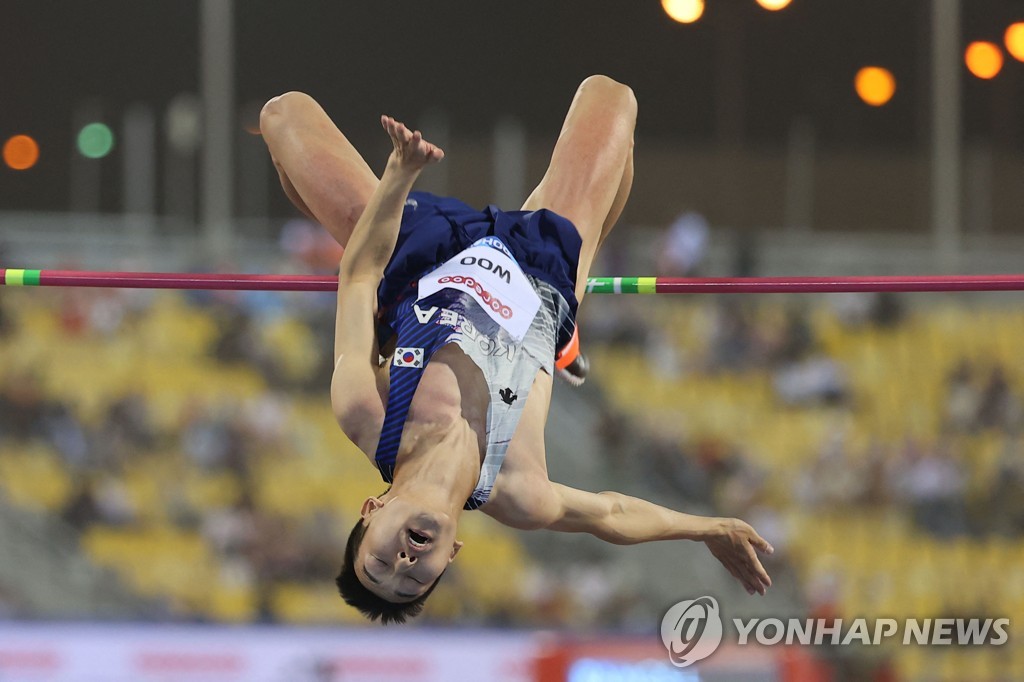 In this AFP photo, Woo Sang-hyeok of South Korea competes in the men's high jump event at the World Athletics Diamond League competition at Khalifa International Stadium in Doha on May 13, 2022. (Yonhap)