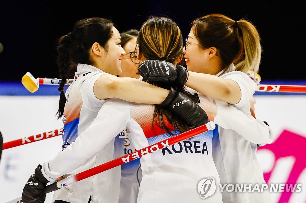 In this EPA file photo from Dec. 18, 2021, members of the South Korean women's curling team celebrate their 8-5 victory over Latvia in the final playoff game at the Olympic Qualification Event in Leeuwarden, the Netherlands. (Yonhap)