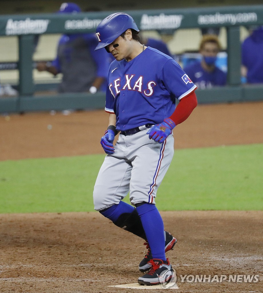 In this Getty Images photo, Choo Shin-soo of the Texas Rangers touches home plate after hitting a home run against the Houston Astros in a Major League Baseball regular season game at Minute Maid Park in Houston on Sept. 3, 2020. (Yonhap)