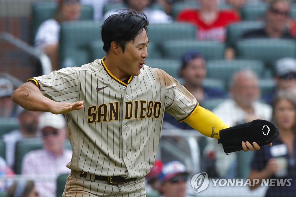 In this Getty Images photo, Kim Ha-seong of the San Diego Padres celebrates after scoring a run against the Atlanta Braves during the top of the 11th inning of a Major League Baseball regular season game at Truist Park in Atlanta on May 15, 2022. (Yonhap)