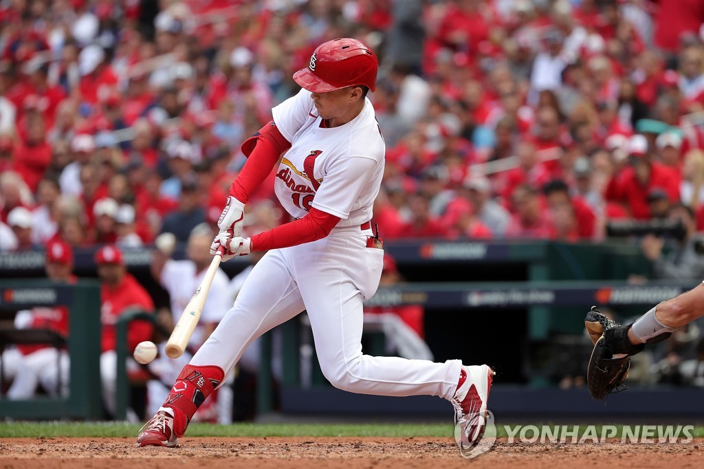 In this Getty Images file photo from Oct. 7, 2022, Tommy Edman of the St. Louis Cardinals takes a swing during the bottom of the sixth inning of Game 1 of the National League Wild Card Series against the Philadelphia Phillies at Busch Stadium in St. Louis. (Yonhap)