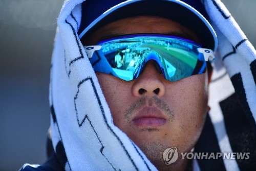 TORONTO, ON- DECEMBER 27 - Hyun-Jin Ryu stands with his wife Jinny