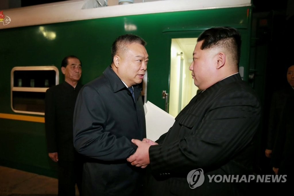 In this file photo, captured from North Korea's Central TV on April 26, 2018, North Korean leader Kim Jong-un (R) talks with Chinese Ambassador to Pyongyang Li Jinjun at a station in Pyongyang the previous day. Li was seeing off a special train carrying the bodies of Chinese nationals killed and wounded in a bus crash. (For Use Only in the Republic of Korea. No Redistribution) (Yonhap) 