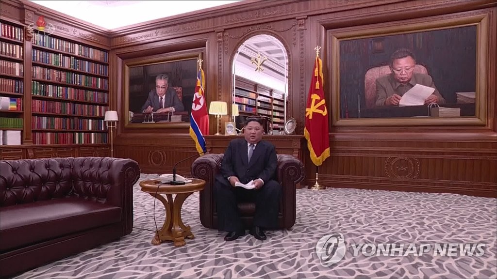 This image from North Korean state TV shows North Korean leader Kim Jong-un delivering a New Year's speech at an office in Pyongyang on Jan. 1, 2019. (For Use Only in the Republic of Korea. No Redistribution.) (Yonhap)