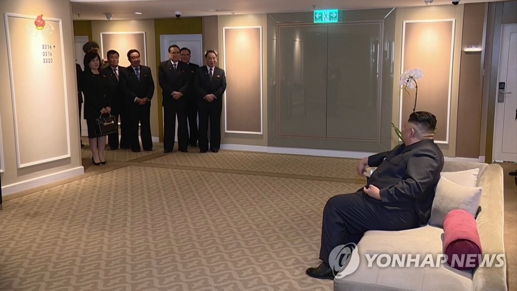 North Korean officials listen as their country's leader Kim Jong-un addresses them at a hotel in Hanoi where Kim was staying, in this photo captured from a documentary aired by the North's Korean Central TV on March 6, 2019. (For Use Only in the Republic of Korea. No Redistribution) (Yonhap)