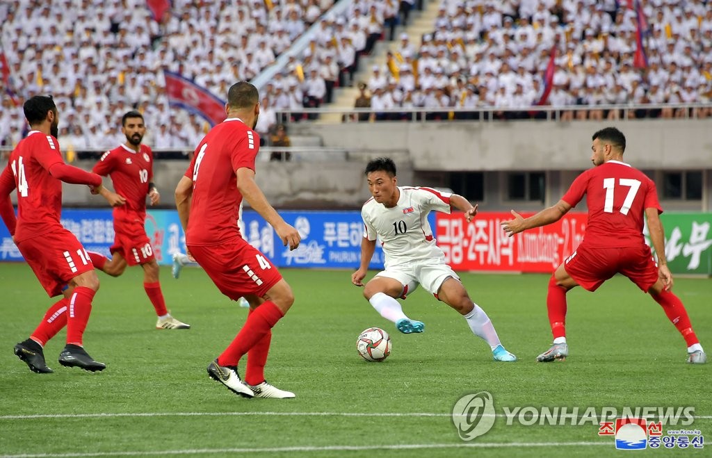 Kim Kum-chol (2nd from R) of North Korea dribbles the ball during a Group H Asian qualifier against Lebanon for the 2022 football World Cup at Kim Il-sung Stadium in Pyongyang on Sept. 5, 2019, in this file photo released by the North's official Korean Central News Agency. According to the Seoul-based Korea Football Association (KFA), the Asian Football Confederation has informed the KFA that North Korea will host South Korea on Oct. 15, as scheduled, for their Group H match in the second round of the Asian qualification for the World Cup. (For Use Only in the Republic of Korea. No Redistribution) (Yonhap)