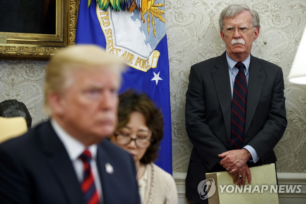 This AP photo shows then-U.S. National Security Adviser John Bolton (R) at a summit between U.S. President Donald Trump (L) and South Korean President Moon Jae-in (not pictured) at the White House in Washington on May 22, 2018. (Yonhap)