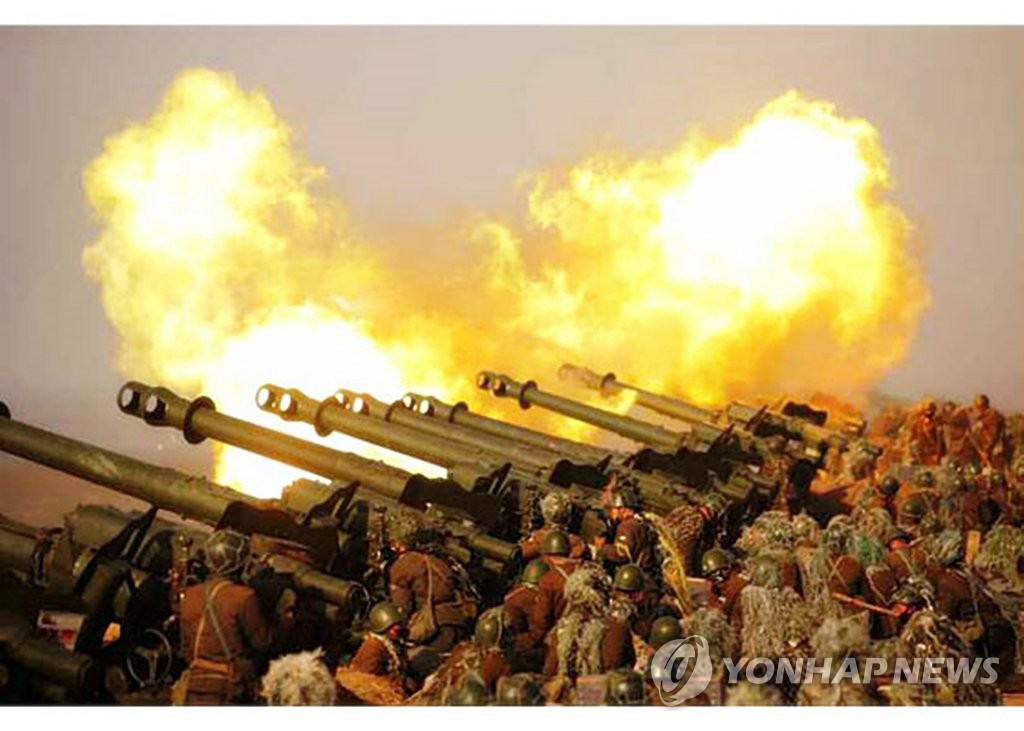 This photo released on March 21, 2020 by the Rodong Sinmun, the North's official newspaper, shows North Korean soldiers engage in an artillery fire drill held a day earlier. (For Use Only in the Republic of Korea. No Redistribution) (Yonhap) 