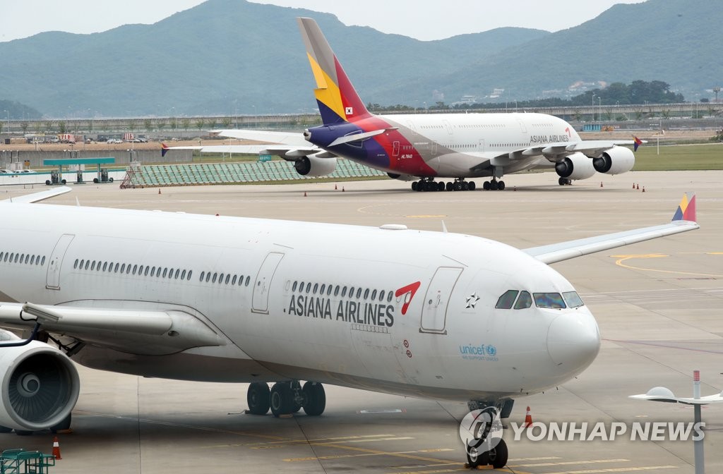 This file photo taken June 10, 2020, shows Asiana Airlines' planes at Incheon International Airport in Incheon, just west of Seoul. (Yonhap)
