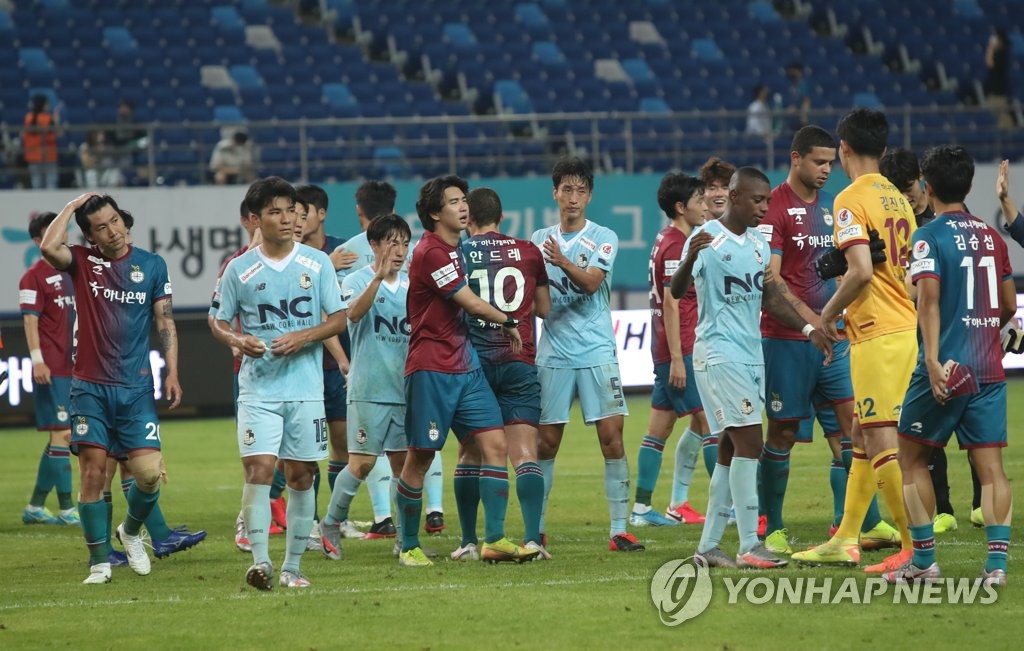 In this file photo from Aug. 17, 2020, players for Daejeon Hana Citizen and Seoul E-Land acknowledge each other after a 0-0 draw in their K League 2 match at Daejeon World Cup Stadium in Daejeon, 160 kilometers south of Seoul. (Yonhap)