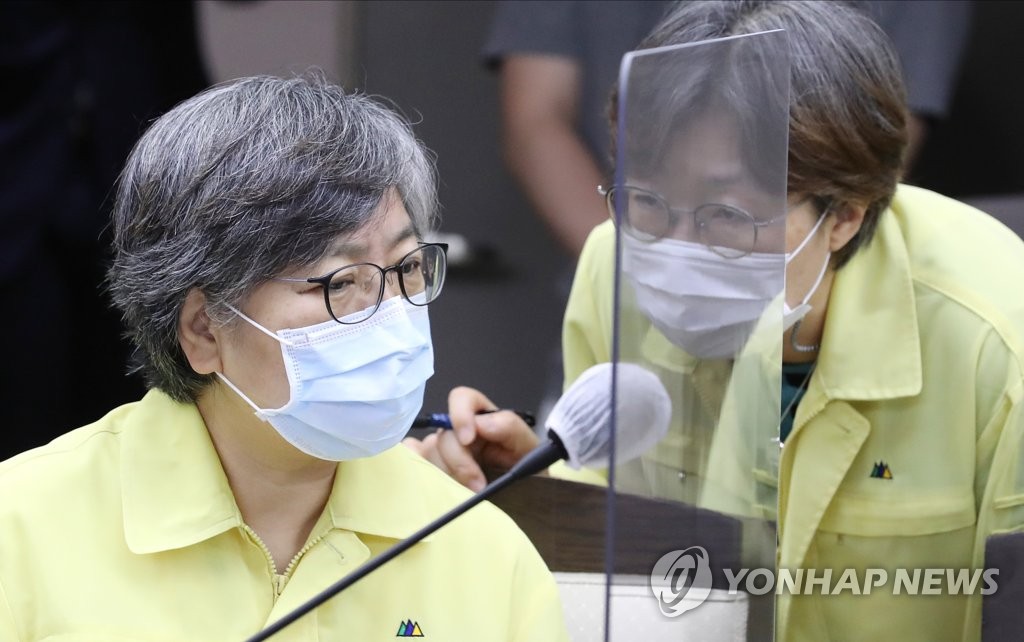 Jeong Eun-kyeong (L), director of the Korea Centers for Disease Control and Prevention (KCDC), attends a government meeting on the country's response to the new coronavirus at the government complex building in the administrative city of Sejong on Sept. 2, 2020. (Yonhap)