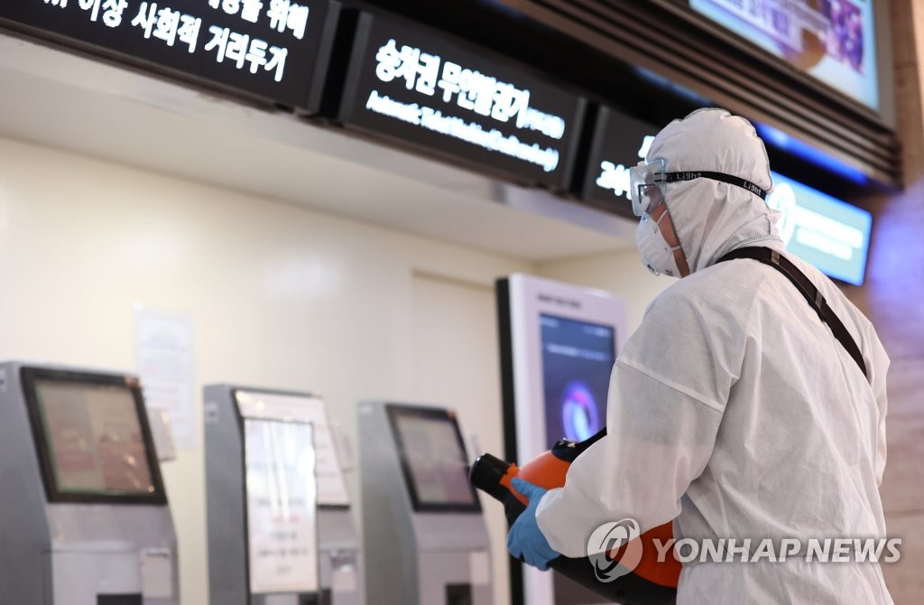 A worker disinfects a bus terminal in southern Seoul on Sept. 4, 2020. (Yonhap)