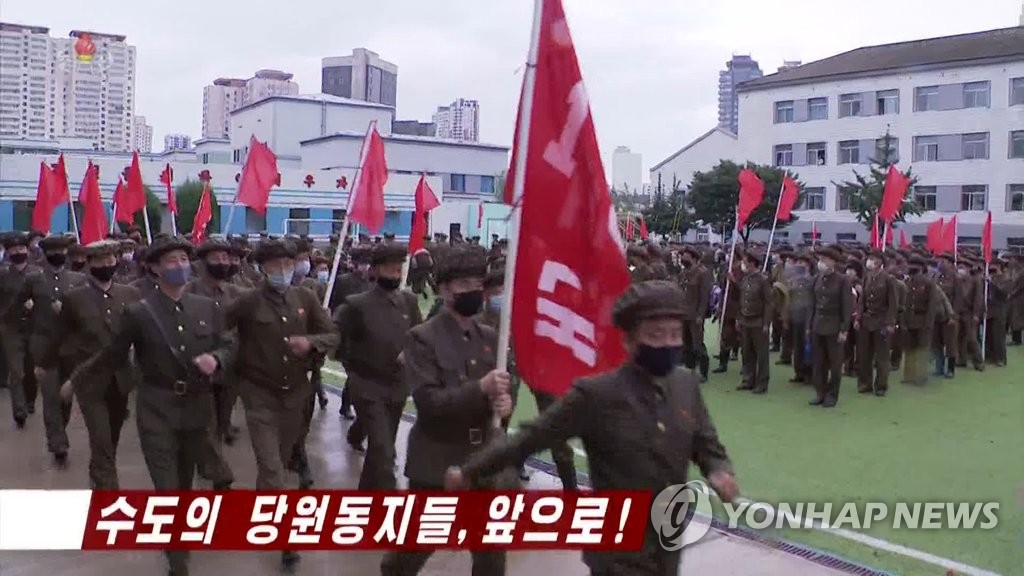 People in Pyongyang form columns as they march to help Hamgyong Province, which was hit hard by Typhoon Maysak, in this image captured from footage of the state-run Korean Central Television on Sept. 8, 2020. (For Use Only in the Republic of Korea. No Redistribution) (Yonhap)