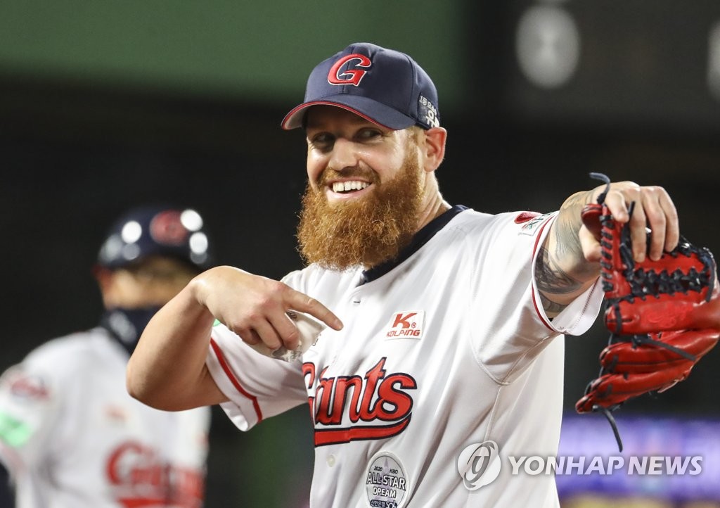 In this file photo from Sept. 22, 2020, Dan Straily of the Lotte Giants smiles on his way back to the dugout after completing the top of the third inning of a Korea Baseball Organization regular season game against the KT Wiz at Sajik Stadium in Busan, 450 kilometers southeast of Seoul. (Yonhap)