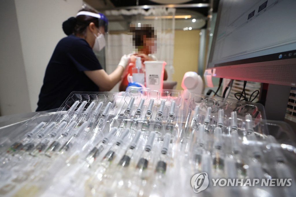 The file photo taken Sept. 23, 2020, shows a person getting an influenza vaccine at a medical clinic in western Seoul. (Yonhap)
