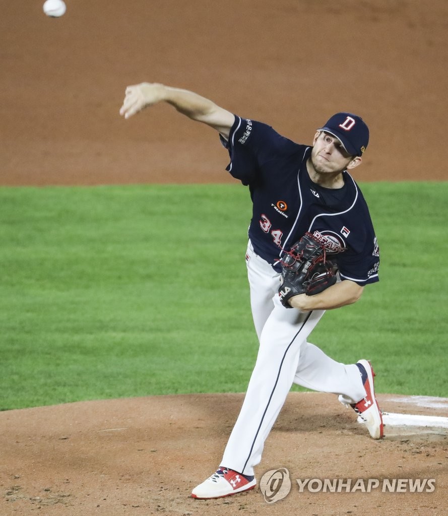 In this file photo from Oct. 20, 2020, Chris Flexen of the Doosan Bears pitches against the Lotte Giants in the bottom of the first inning of a Korea Baseball Organization regular season game at Sajik Stadium in Busan, 450 kilometers southeast of Seoul. (Yonhap)
