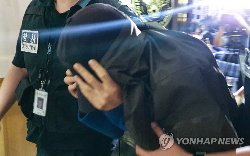 마포 오피스텔 40대 남성 살인 피의자 경산에서 검거돼 서울로 압송