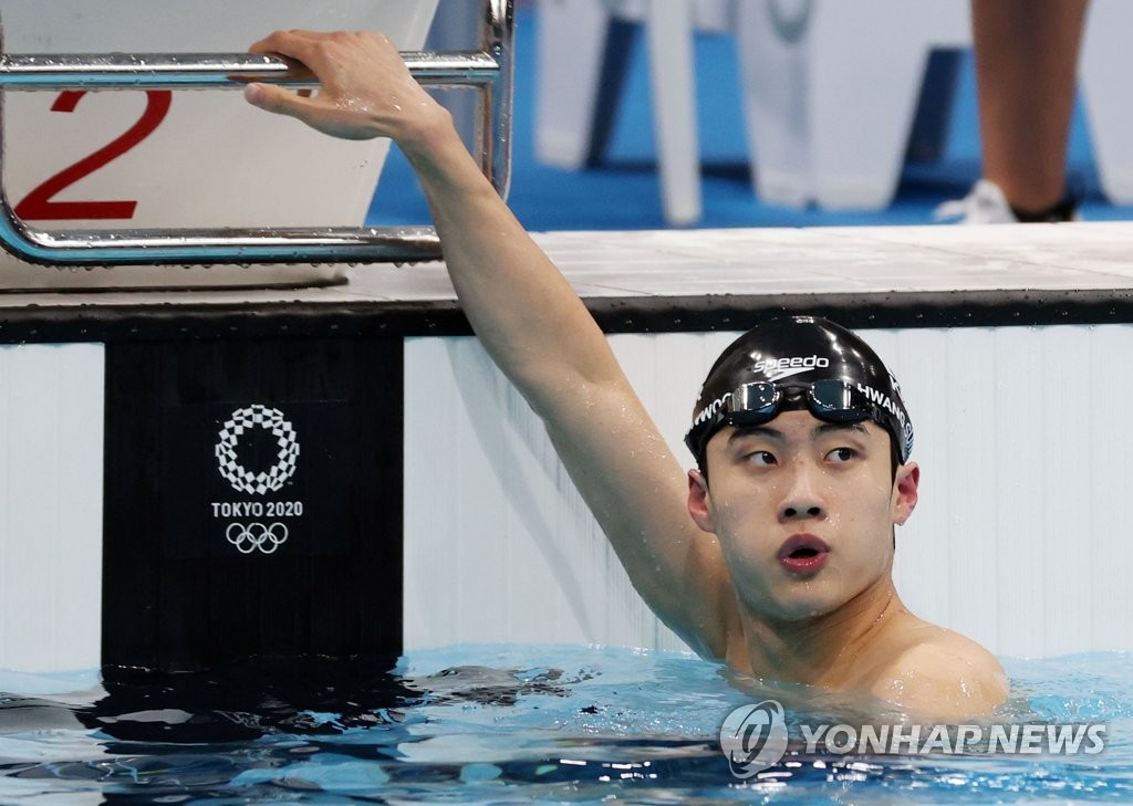 In this file photo from July 28, 2021, Hwang Sun-woo of South Korea checks his time after the men's 100m freestyle semifinals at Tokyo Aquatics Centre during the Tokyo Olympics. (Yonhap)