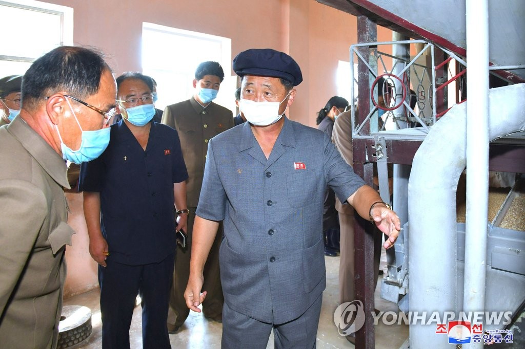 North Korean Premier Kim Tok-hun (R) visits a food administration unit in Jaeryong, South Hwanghae Province, as part of his inspection of the agricultural sector, in this undated photo released by the Korean Central News Agency on Oct. 5, 2021. (For Use Only in the Republic of Korea. No Redistribution) (Yonhap) 