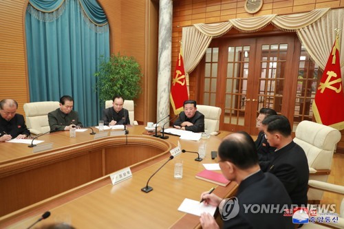 N.K. leader presides over politburo meeting
