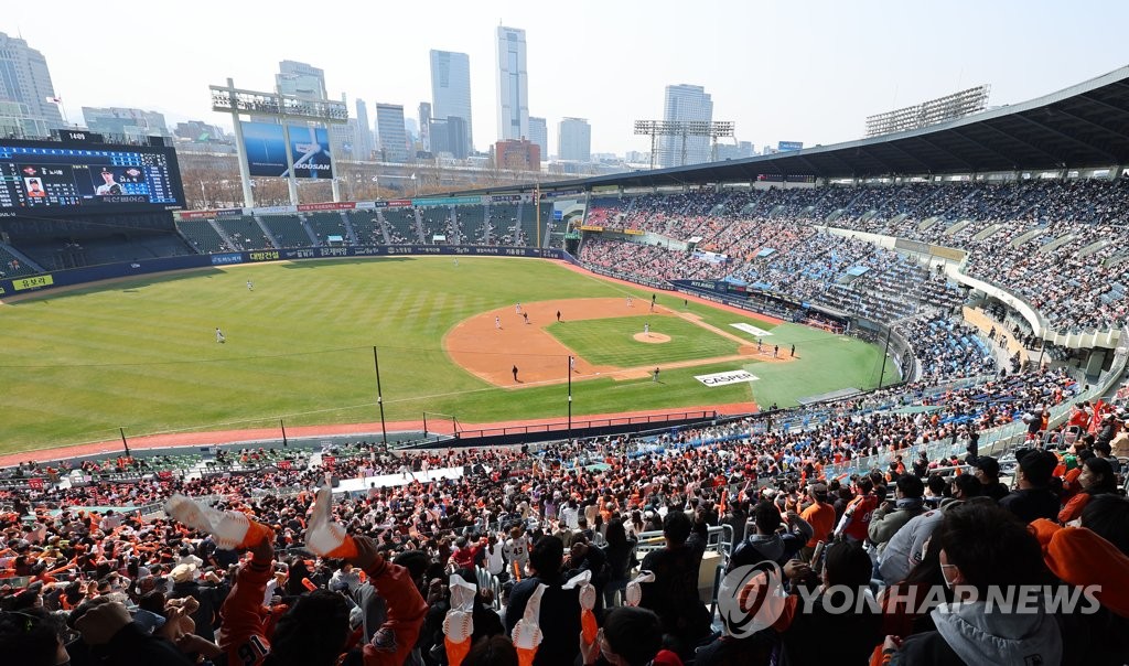 Fans watch a Korea Baseball Organization regular season game between the home team Doosan Bears and the Hanwha Eagles at Jamsil Baseball Stadium in Seoul on April 2, 2022. (Yonhap)