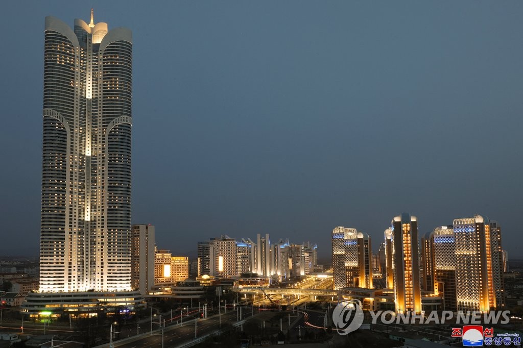 This photo, released by the Korean Central News Agency on April 12, 2022, shows a nighttime view of the Songhwa District in eastern Pyongyang. North Korean leader Kim Jong-un attended its dedication ceremony the previous day. (For Use Only in the Republic of Korea. No Redistribution) (Yonhap)