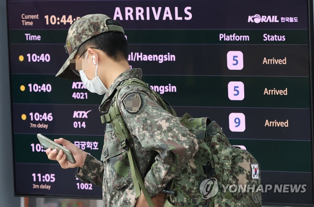 A service member walks at Seoul Station in central Seoul on April 29, 2022. (Yonhap)