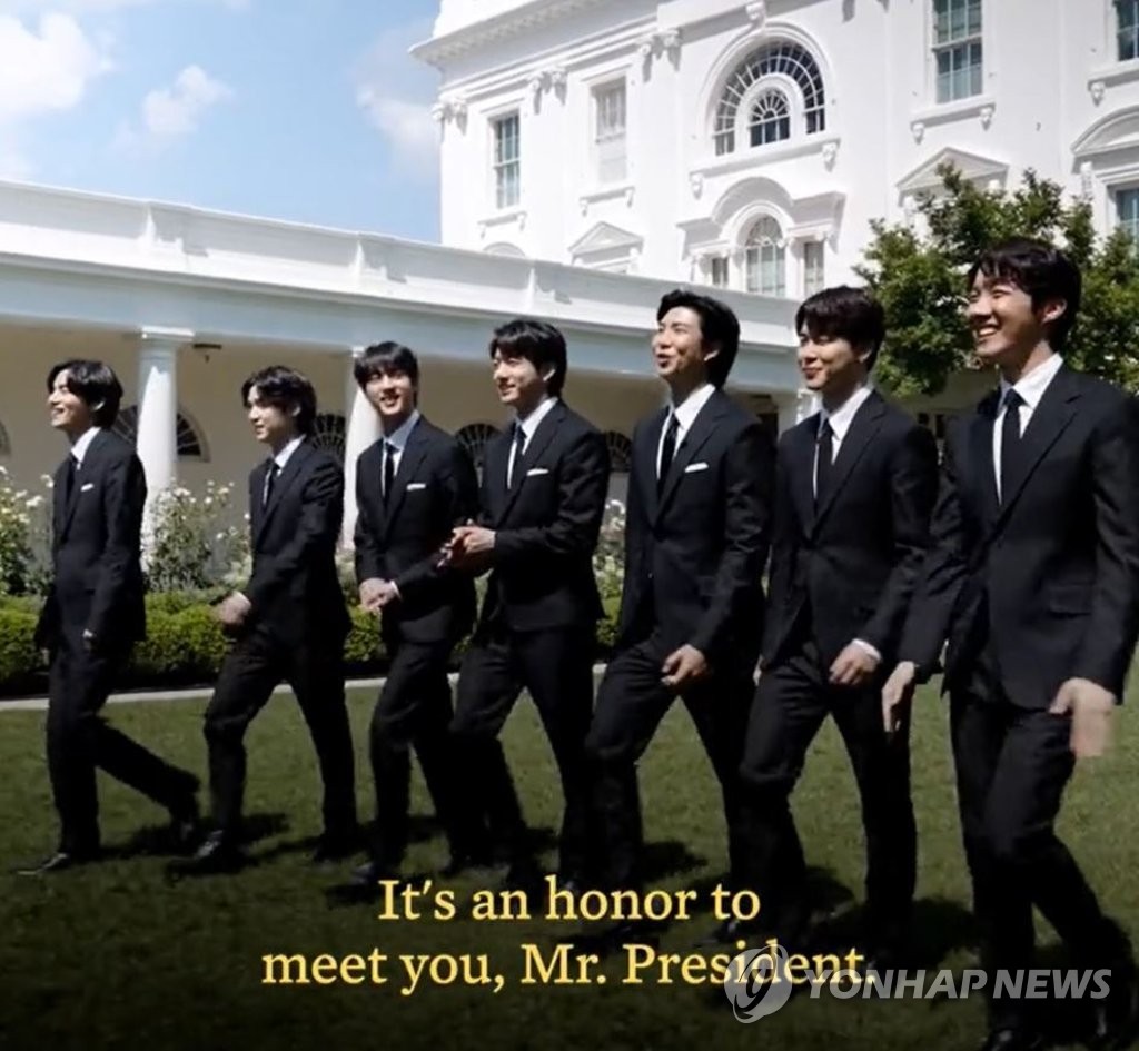 This image, captured from a video clip posted on U.S. President Joe Biden's official Twitter page, shows members of the South Korean group BTS on their way to a meeting with Biden in the White House on May 31, 2021. (PHOTO NOT FOR SALE) (Yonhap)