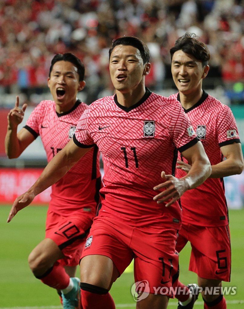 Hwang Hee-chan of South Korea (C) celebrates after scoring a goal against Chile during the countries' football friendly match at Daejeon World Cup Stadium in Daejeon, some 160 kilometers south of Seoul, on June 6, 2022. (Yonhap)