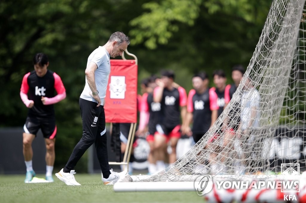 South Korea head coach Paulo Bento takes a moment during a training session at the National Football Center in Paju, 30 kilometers north of Seoul, on June 13, 2022, the eve of a friendly match against Egypt, in this photo provided by the Korea Football Association. (PHOTO NOT FOR SALE) (Yonhap)