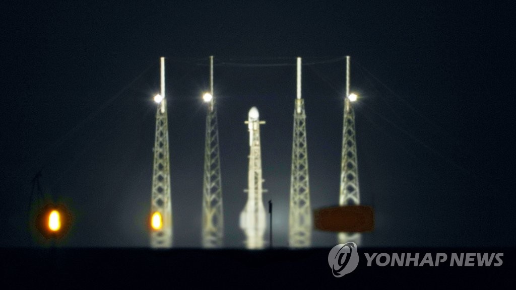 This image provided by the South Korean science ministry on Aug. 4, 2022, shows a SpaceX Falcon 9 rocket carrying Danuri, a Korean lunar orbiter, erected on the launch pad at Cape Canaveral Space Force Station in the U.S. state of Florida. (PHOTO NOT FOR SALE) (Yonhap) 
