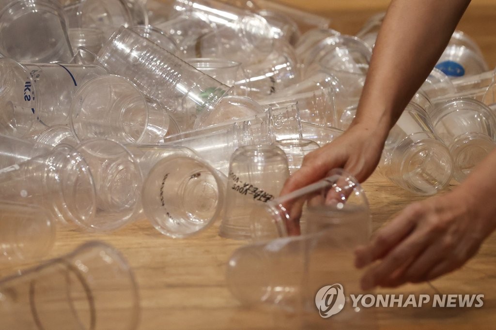This file image shows plastic takeaway cups. (Yonhap)