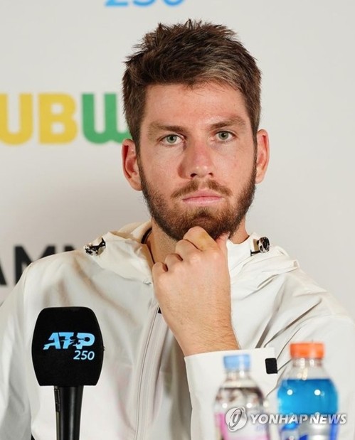 Cameron Norrie of Britain listens to a question during a press conference prior to his first match at the ATP Eugene Korea Open at Olympic Park Tennis Center in Seoul on Sept. 28, 2022, in this photo provided by the tournament organizing committee. (PHOTO NOT FOR SALE (Yonhap)