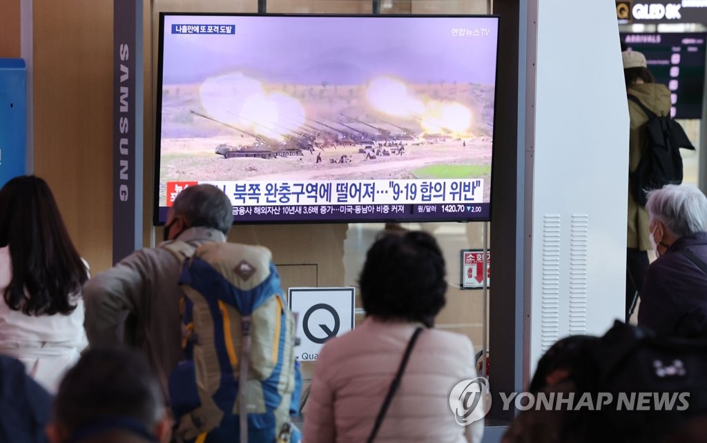This photo, taken Oct. 19, 2022, shows a news report on a North Korean military provocation being aired on a TV screen at Seoul Station in Seoul. (Yonhap)