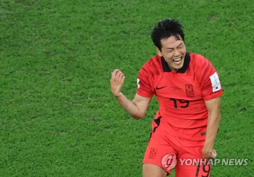 Kim Young-gwon cheers after scoring equalizer