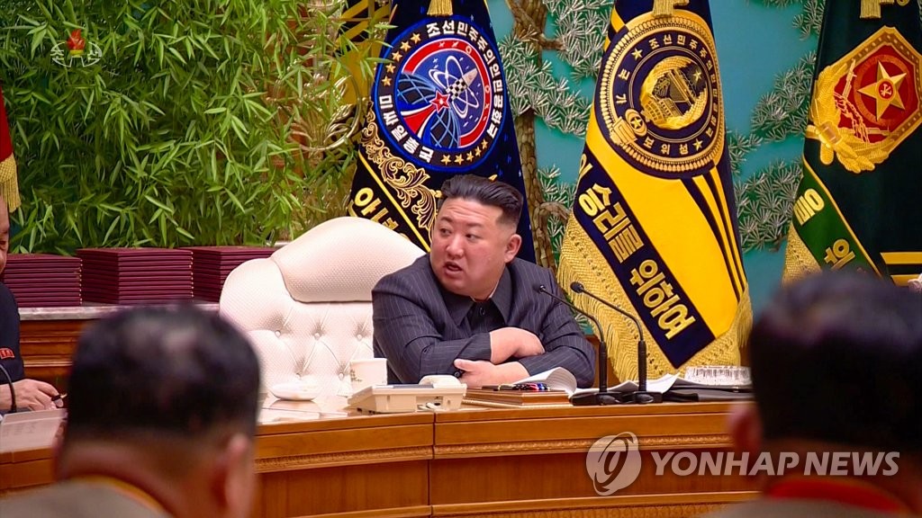 This photo, carried by North Korea's official Korean Central News Agency on Feb. 7, 2023, shows one of the flags behind the North's leader Kim Jong-un displaying the words "General Administration of Missiles" and having a symbol of a missile being fired. (For Use Only in the Republic of Korea. No Redistribution) (Yonhap)