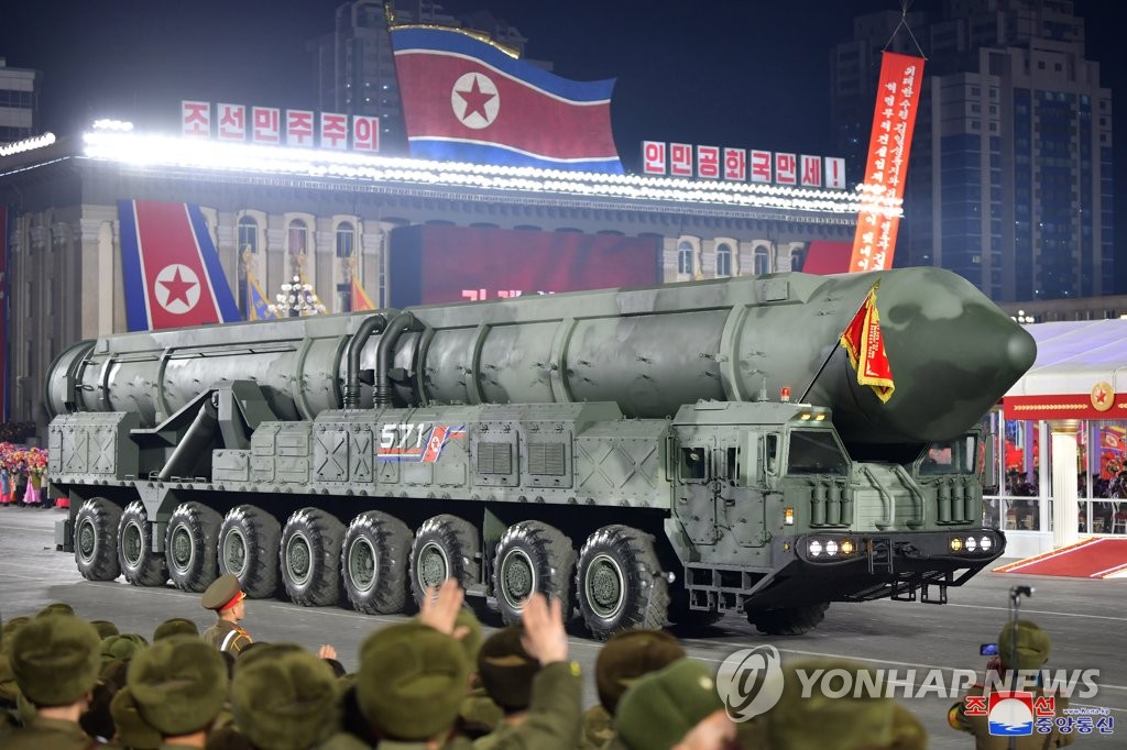 This photo, carried by North Korea's official Korean Central News Agency on Feb. 9, 2023, shows the North displaying what was presumed to be a solid-fuel intercontinental ballistic missile during a military parade held at Kim Il Sung Square the previous day. (For Use Only in the Republic of Korea. No Redistribution) (Yonhap)