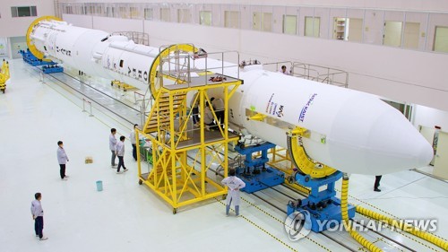 Officials integrate the upper stage with the lower stages of South Korea's homegrown rocket Nuri at the Naro Space Center in Goheung, South Jeolla Province, on May 17, 2023. (PHOTO NOT FOR SALE) (Yonhap)