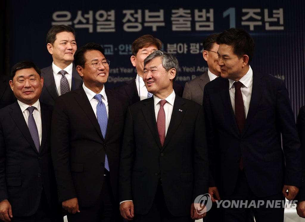 Key officials and participants pose for a photo during a conference assessing the first-year diplomacy and security policy of the Yoon Suk Yeol administration on June 9, 2023. (Yonhap)