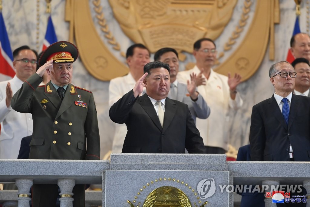 North Korean leader Kim Jong-un (C), Russian Defense Minister Sergei Shoigu (L) and Li Hongzhong, a politburo member of the Chinese Communist Party, attend a military parade in Pyongyang to mark the 70th anniversary of the armistice that halted fighting in the 1950-53 Korean War, in this photo released on July 28, 2023, by the North's official Korean Central News Agency. (For Use Only in the Republic of Korea. No Redistribution) (Yonhap)