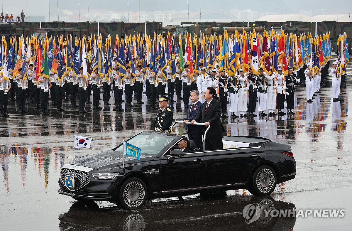 President Yoon Suk Yeol (R, in car) reviews troops during a ceremony to mark the 75th Armed Forces Day at Seoul Air Base in Seongnam, south of Seoul, on Sept. 26, 2023. (Yonhap)