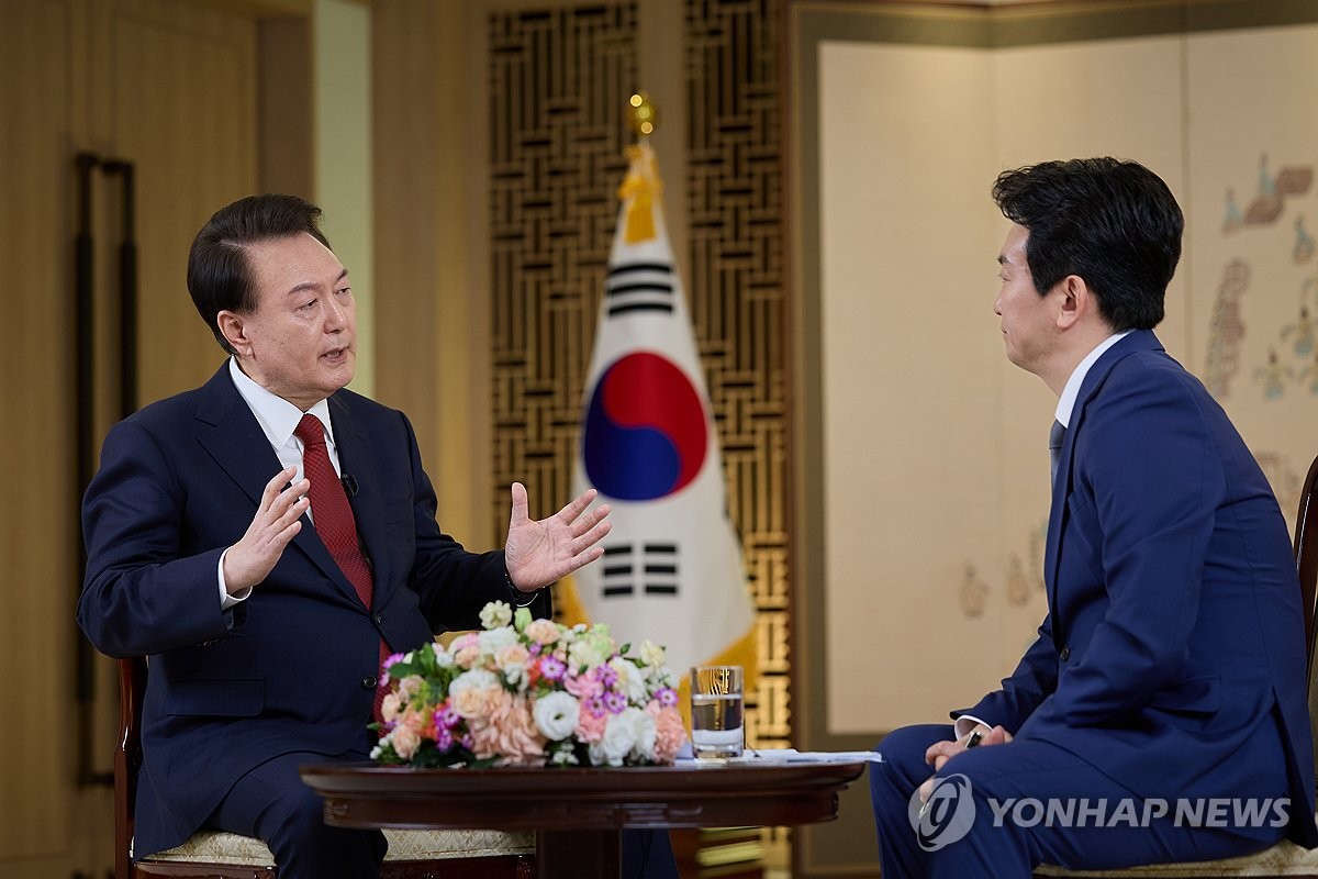 President Yoon Suk Yeol (L) speaks during a special interview with state-run broadcaster KBS at the presidential office in Seoul on Feb. 4, 2024, in this photo provided by the office. (PHOTO NOT FOR SALE) (Yonhap)